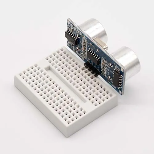 Insert Ultrasonic Range Finder into breadboard